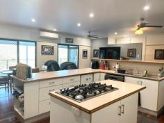 289 Pernas Road Kuttabul QLD 4741 $1,180,000 The perfect mix of large home, improved pasture, rainforest, water security and creek frontage! At the end of a private road and with an easy half-hour commute to Mackay, this property is one to put at the top of your list for country lifestyle and city conveniences. Bus service close by for local primary and secondary schools, 10 minutes to Kuttabul post office and general store, rubbish collection at the turn-off. The house: Perched at the foot of the rainforest covered hill, overlooking beautiful valley views. Offering 5 bedrooms; generous sized main with walk-through robe and ensuite, also access to the verandah. Adjacent are a further 2 off the hall, 1 queen and 1 single/office size. At the other end of the home we have 2 large rooms, 1 with access to the 2-way family bathroom and the deck, all have built-in robes. In between enjoy spacious open plan living combined with the kitchen at the heart of the home. Quality Ariston 6 burner island cooktop, wall oven, dishwasher, breakfast bar, amazing walk-through pantry with access straight to the carport and an extra 'fridge room' for more storage. Air conditioning, ceiling fans and polished timber floors throughout. Plenty of carport space at the back, 5.5kw solar array, and full-length front and side timber deck to soak up the serenity while enjoying your morning coffee or afternoon bevvies. Sheds: A combination of storage with a high-clearance 6 x 12m shed & additional awning below the house, down on the flat you'll find a converted machinery shed with mezzanine floor, kitchenette, rustic bathroom and air-con, adjacent 6 x 9 lock-up shed with 2 roller doors and ample extra undercover space for hay or machinery. Land: Approximately half of the 152 acre block is under a combination of natural grasses and improved pasture with seca stylo, pangola, rhodes, humidicola and seteria present, the remainder the hillside behind the house rising to natural rainforest and scrubland. Fenced into 5 main paddocks, each with water points, 1 with approximately 20 mature bowen mango trees. Set up for cell rotation, there are also 4 smaller paddocks and a combination of animal shelters along the laneway linking everything to the yards. Good access to 2yo loading ramp and vet crush with portable panel yards. Water security and features: Set up around the property are a total of 10 x 5000gal tanks which serve a combination of rainwater by pressure pump to the house and storage of pumped water from the permanent creek under a livestock licence by way of solar powered submersible, which gravity feeds to all stock troughs. A picturesque dam which holds well, and your very own swimming hole with waterfall in the permanent spring-fed creek that flows along the bottom boundary.