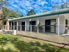 289 Pernas Road Kuttabul QLD 4741 $1,180,000 The perfect mix of large home, improved pasture, rainforest, water security and creek frontage! At the end of a private road and with an easy half-hour commute to Mackay, this property is one to put at the top of your list for country lifestyle and city conveniences. Bus service close by for local primary and secondary schools, 10 minutes to Kuttabul post office and general store, rubbish collection at the turn-off. The house: Perched at the foot of the rainforest covered hill, overlooking beautiful valley views. Offering 5 bedrooms; generous sized main with walk-through robe and ensuite, also access to the verandah. Adjacent are a further 2 off the hall, 1 queen and 1 single/office size. At the other end of the home we have 2 large rooms, 1 with access to the 2-way family bathroom and the deck, all have built-in robes. In between enjoy spacious open plan living combined with the kitchen at the heart of the home. Quality Ariston 6 burner island cooktop, wall oven, dishwasher, breakfast bar, amazing walk-through pantry with access straight to the carport and an extra 'fridge room' for more storage. Air conditioning, ceiling fans and polished timber floors throughout. Plenty of carport space at the back, 5.5kw solar array, and full-length front and side timber deck to soak up the serenity while enjoying your morning coffee or afternoon bevvies. Sheds: A combination of storage with a high-clearance 6 x 12m shed & additional awning below the house, down on the flat you'll find a converted machinery shed with mezzanine floor, kitchenette, rustic bathroom and air-con, adjacent 6 x 9 lock-up shed with 2 roller doors and ample extra undercover space for hay or machinery. Land: Approximately half of the 152 acre block is under a combination of natural grasses and improved pasture with seca stylo, pangola, rhodes, humidicola and seteria present, the remainder the hillside behind the house rising to natural rainforest and scrubland. Fenced into 5 main paddocks, each with water points, 1 with approximately 20 mature bowen mango trees. Set up for cell rotation, there are also 4 smaller paddocks and a combination of animal shelters along the laneway linking everything to the yards. Good access to 2yo loading ramp and vet crush with portable panel yards. Water security and features: Set up around the property are a total of 10 x 5000gal tanks which serve a combination of rainwater by pressure pump to the house and storage of pumped water from the permanent creek under a livestock licence by way of solar powered submersible, which gravity feeds to all stock troughs. A picturesque dam which holds well, and your very own swimming hole with waterfall in the permanent spring-fed creek that flows along the bottom boundary.