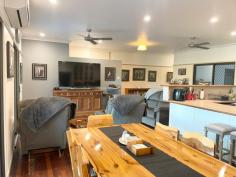 289 Pernas Road Kuttabul QLD 4741 $1,180,000 The perfect mix of large home, improved pasture, rainforest, water security and creek frontage! At the end of a private road and with an easy half-hour commute to Mackay, this property is one to put at the top of your list for country lifestyle and city conveniences. Bus service close by for local primary and secondary schools, 10 minutes to Kuttabul post office and general store, rubbish collection at the turn-off. The house: Perched at the foot of the rainforest covered hill, overlooking beautiful valley views. Offering 5 bedrooms; generous sized main with walk-through robe and ensuite, also access to the verandah. Adjacent are a further 2 off the hall, 1 queen and 1 single/office size. At the other end of the home we have 2 large rooms, 1 with access to the 2-way family bathroom and the deck, all have built-in robes. In between enjoy spacious open plan living combined with the kitchen at the heart of the home. Quality Ariston 6 burner island cooktop, wall oven, dishwasher, breakfast bar, amazing walk-through pantry with access straight to the carport and an extra 'fridge room' for more storage. Air conditioning, ceiling fans and polished timber floors throughout. Plenty of carport space at the back, 5.5kw solar array, and full-length front and side timber deck to soak up the serenity while enjoying your morning coffee or afternoon bevvies. Sheds: A combination of storage with a high-clearance 6 x 12m shed & additional awning below the house, down on the flat you'll find a converted machinery shed with mezzanine floor, kitchenette, rustic bathroom and air-con, adjacent 6 x 9 lock-up shed with 2 roller doors and ample extra undercover space for hay or machinery. Land: Approximately half of the 152 acre block is under a combination of natural grasses and improved pasture with seca stylo, pangola, rhodes, humidicola and seteria present, the remainder the hillside behind the house rising to natural rainforest and scrubland. Fenced into 5 main paddocks, each with water points, 1 with approximately 20 mature bowen mango trees. Set up for cell rotation, there are also 4 smaller paddocks and a combination of animal shelters along the laneway linking everything to the yards. Good access to 2yo loading ramp and vet crush with portable panel yards. Water security and features: Set up around the property are a total of 10 x 5000gal tanks which serve a combination of rainwater by pressure pump to the house and storage of pumped water from the permanent creek under a livestock licence by way of solar powered submersible, which gravity feeds to all stock troughs. A picturesque dam which holds well, and your very own swimming hole with waterfall in the permanent spring-fed creek that flows along the bottom boundary.