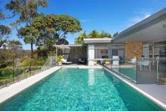 12 Athlone Crescent Killarney Heights NSW 2087 A striking masterpiece on 777sqm (approx.), this luxuriously appointed residence delivers an enviable lifestyle opportunity for discerning families who love to entertain. Exuding a chic aesthetic fused with high-calibre finishes, its stunning array of fluid living spaces and abundant oversized accommodation options provide the ultimate haven for growing families. With a brick façade and large lawn, the property's resort-inspired alfresco spaces spill out to the solar heated pool and Garigal National Park just beyond with outstanding bushland views. Positioned in a tightly held enclave, mere footsteps to walking tracks, it's a short stroll to Killarney Heights High School and just 1km to the village shops and café culture. Large open plan living areas perfect for entertaining guests Designer kitchen equipped with Miele appliances and Caesarstone benchtops Induction cooktop, Carysil sinks, concealed laundry and custom walk in pantry All-weather entertaining deck overlooks the solar heated pool and bushland Multiple living zones including a formal dining room and family room that opens to pool Three bedrooms on ground level including Master with ensuite and pool access Two spacious bedrooms plus a bathroom upstairs, perfect as a teenage retreat Downstairs bathrooms have been renovated, main features a freestanding bath Summer air-conditioning and under floor winter heating for year round comfort Footsteps to Magazine Track and Bates Creek, 1.1km walk to Killarney Hts High Quiet bushland pocket with easy access to the area's shopping and transport Extensive storage and built-ins for the needs of a large family home Solar heated saltwater pool adjoins sunny decks for alfresco entertaining Rainwater tank to serve easy care lawns and pool