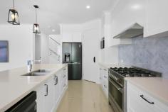 24 Sormano Street Reedy Creek QLD 4227 $1,999,000 This exquisite Hamptons-style residence exudes elegance from its prime location in the heights of Reedy Creek, boasting a serene view of the adjacent bushland reserve. Situated on a generous 1000m2 plot, this home has been impeccably crafted to cater to every family's comfort. Spanning across two levels, this residence offers numerous living spaces within a 349m2 floor plan. As you step inside, you're welcomed by a spacious entryway. To the left, you'll discover the downstairs bedroom quarters, while to the right, an open-plan living area unfolds. The heart of this space is the expansive kitchen, surrounded by a welcoming lounge, dining area, and family rooms. These areas feature 9-foot ceilings, ceiling fans, and even a bar for entertaining guests. Ascending the stairs, you'll find the luxurious parents' retreat. This impeccably designed area includes a private lounge, an extensive walk-in wardrobe, an luxurious ensuite, and a master bedroom grand in size that offers stunning views over the reserve. Throughout the home, the Hamptons aesthetic is maintained with plantation shutters adorning the front windows. Comfort is ensured year-round with ducted zoned air conditioning. At the rear of the home, you'll discover an outdoor oasis, perfect for hosting summer gatherings. The sparkling magnesium pool has undergone a complete renovation, including new slab, tiling, pool equipment, filtration system, and updated fencing make the pool area the jewel of the home. The entire home has been given a fresh look, with a new paint job, updated kitchen cabinetry, and stylish door handles and window tinting. In addition, it offers energy-efficient features, such as a 13.5kWh solar system with a 10kWh inverter and a high-speed Tesla wall charger in the spacious double garage. Homes of this caliber and design are a rarity, so don't delay – contact Freddie today to inquire about the next inspection opportunity.