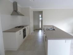 Unit 2/110 Greta Dr Hamilton Valley NSW 2641 $380,000 This modern 3 bedroom townhouse offers a large kitchen with stainless steel appliances including gas cooktop, electric fan forced oven and dishwasher, tiled open plan living area with split system heating and cooling, walk-in robe to master bedroom, built-in robes in other bedrooms, full bathroom, undercover outdoor entertaining area, enclosed back yard, and single lock-up garage with remote and internal access into the home. Currently leased at $390 per week, or purchase with vacant possession.