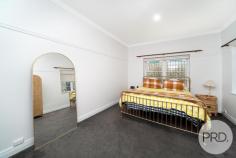 9 Coleman Street Turvey Park NSW 2650 $1,050,000 Welcome to 9 Coleman Street, Turvey Park! This stunning 4-bedroom, 2-bathroom house is the perfect family home, offering spacious living areas and a range of desirable features on a 3 tiered home. Located on the highly desirable end of Coleman Street, you are walking distance to TAFE, Wagga High, Kildare Catholic College, the Wagga CBD and great cafes and parks. Situated on a generous 689sqm block, this property boasts a beautiful backyard and balcony, providing ample space for outdoor entertaining and relaxation. The well-designed architecture of the house creates a stylish and modern atmosphere, with hardwood flooring throughout the living areas, high ornate ceilings and beuatiful period features throughout. The interior of the house is thoughtfully designed, freshly painted throughout, its light and bright and oozes charm, character and light. With a spacious dining room and living room that flow seamlessly together. The kitchen is equipped with ample storage space. The bedrooms are all generously sized, providing plenty of space for the whole family with built in wardrobes to all. The master bedroom features an ensuite bathroom and a built-in wardrobe, creating a luxurious retreat to the rear of the home. Downstairs is access internally or via the backyard and can create the perfect home office, kids retreat, rumpus room or home gym set up, opening up onto the large backyard with a northerly aspect. There is plenty of space for parking with a double carport to the front and large single shed through the gates. Solar installed which will minimise those rising electricity costs. The complete Turvey Package! This home is sure to tick the boxes.