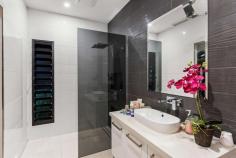 6 Hatoyama View Bilingurr WA 6725 $949,000 Adjacent to native bushland and situated on a quiet street consisting of just 7 premium executive homes, your dream home becomes a reality at 6 Hatoyama View. Constructed in 2014 with exquisite attention to detail, no expense has been spared in creating a master home that WOWS from front to back. The home's free-flowing floorplan leads to the open-concept living, dining, and kitchen areas with gleaming porcelain tile flooring underfoot that mirrors the downlights soaring overhead. The gourmet kitchen will impress the most ardent of chefs and stays true to being the heart of this home, featuring a central island breakfast bar illuminated by pendant lighting, ample bench space and abundant storage, including a walk-in pantry. There is no need to worry about uncomfortably warm days with air conditioning and ceiling fans servicing the entire floor plan, ensuring exceptional comfort throughout the home no matter the weather. There is also professionally installed window tinting throughout to ensure the home stays extra cool during the hot summer months. The bedrooms offer supreme levels of comfort with the master bedroom decorated with a walk-in robe and a three-piece ensuite, while the three additional bedrooms feature built-in robes, providing ample space for the entire family. The main family bathroom is a testament to opulence, boasting a luxurious dual vanity, a relaxing tub and a spacious walk-in shower. Meanwhile, the toilet is conveniently located in the next room, ensuring seamless functionality for your daily routine. But the true magic awaits outside, where an awe-inspiring tropical oasis unfolds. Covered by an elegant cedar lined ceiling, this space is perfect for entertaining with a fully equipped outdoor kitchen and BBQ grill standing ready to turn ordinary evenings into extraordinary memories. Beyond, a sparkling 10 metre pool, with Travertine tile surrounds and complete with a water slide and designer water feature, shimmers in the sunlight, offering endless hours of aquatic delight. Overlooking the pool area is the Bali style Cabana, again, showcasing the exquisite attention to detail evident throughout this extraordinary home. The cabana is constructed to the highest standard and includes cedar lined ceilings and is wired for TV, providing the perfect spot to watch the footy while the kids play in the pool. For those seeking the ultimate relaxation, a separate Mandi-style outdoor bathroom is nestled at the side of the home, complete with a shower, freestanding clawfoot bath and sink. Here, you can wash away the worries of the day in a tranquil and exotic setting. The aesthetic of the outdoor oasis is further elevated by tropical plants, creating a serene environment that feels like a lush paradise. Storage is never an issue, with plenty of space thoughtfully integrated throughout the property. A secure carport with a roller blind ensures your vehicles are protected, while ample off-street parking adds convenience for your guests. There is also a large lockable store room with loft access providing more than enough storage for all your tools and toys! Located in a tranquil location at the northern end of the popular Broome North Estate, the home is within easy walking distance of the excellent Broome North Primary school and several beautiful parks. The golden sands of Cable Beach and the tourist precinct are a short drive or bike ride away. Chinatown and a host of shopping amenities are a 7-minute drive away.