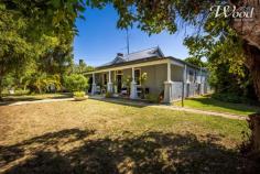 7 Blair St Culcairn NSW 2660 $489,000 Step back in time with this meticulously restored 1920's gem, nestled on a sprawling 1522sqm block with rear lane access. The double-brick residence exudes the charm of a Federation-style home, featuring a central timber hallway and showcasing 4 bedrooms, a few adorned with built-in robes. The master suite boasts a stylish ensuite, while the other bedrooms retain their original character, complete with wood-burning fireplaces and high ceilings. The main bathroom has been tastefully updated for modern convenience. Living spaces are abundant, including a formal lounge with a classic fireplace, an open-plan family room featuring a wood combustion fire, split system air conditioning, and ducted cooling. A meals area seamlessly flows into the outdoor covered pergola, perfect for al fresco dining. The renovated kitchen is a chef's delight, offering an integrated dishwasher, bin drawer, electric cooktop and oven, ample cupboards, and generous preparation space. Situated in a historical locale and once the local priest's residence, this property comes with a 20-panel (7 kW) solar power system for energy efficiency, a separate laundry, dual road access, and easy access to the main street's amenities. Additional features include two garden sheds, a bird aviary, a new roof and guttering, 400-litre hot water service, and town services. Not to be missed, there's even a chook run and a charming, older-style shed for those who appreciate the allure of yesteryears. This remarkable property seamlessly blends the elegance of a bygone era with modern comforts, offering a unique opportunity for a discerning buyer.