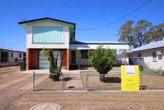 28 Bell Street Biloela QLD 4715 A solid build will get you started with this roomy split-level four-bedroom home. Ideally situated within 500m* of the CBD, enormous potential exists for the homeowner who is looking for a family residence in a great location. The home is centrally located on a 708sqm* allotment with full driveway access to the back yard and a double bay, powered shed. An under covered timber deck is situated at the entrance of the property and is the perfect location to relax and unwind. The upper-level features three carpeted bedrooms with a box air-conditioner in one room and a generously sized master bedroom with sliding door access to a private sunroom. The family bathroom is tidy and is combined with the toilet. The lower level consists of an additional spacious bedroom and an air-conditioned study. A combined kitchen and dining room with a reverse cycle air-conditioner which overlooks the back yard, as well as a separate carpeted living room with a ceiling fan. The single lock up garage is spacious and has direct access into the home via the laundry. As an added bonus, there is a second toilet and shower on the lower level. This is an excellent opportunity to purchase a solid home within walking distance to all amenities and schools.
