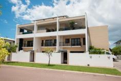 3/2 Annear Court Stuart Park NT 0820 This immaculate executive townhouse offers an enviable bayside lifestyle with plenty of contemporary luxury, set in a prime location walking distance to Tipperary Waters boat ramp, harbour and marina, and just minutes to the city. • Open-plan downstairs living/dining opens to courtyard through bi-fold doors • Private courtyard features paved entertaining and fenced spa with water feature • Premium galley-style kitchen with granite bench tops and stainless steel appliances • Second upstairs living or study area on landing at top of modern staircase • Huge master bedroom features walk-in robe and luxury ensuite with spa bath • Second bedroom features built-in robe and direct access to two-way main bathroom • Third bedroom, also with built-in robe, shares balcony with second bedroom • Immaculate upstairs two-way main bathroom, plus downstairs powder room • European-style internal laundry; split-system air conditioning throughout • Double lock-up garage in modern, well-maintained boutique complex • You'll enjoy the best in low-maintenance modern living in this luxurious corner townhouse that combines spacious light-filled interiors with a private courtyard for easy entertaining. Enter into the generous open-plan living/dining that opens into the courtyard through stunning wall-to-wall bi-fold doors that invite the outdoors inside. The paved courtyard features plenty of room for entertaining and a fenced above-ground spa with water feature adds an extra level of luxury. The long galley-style kitchen with granite bench tops and premium stainless steel appliances including dishwasher will delight the passionate foodie, and a downstairs powder room and European-style internal laundry add convenience. A striking modern staircase leads to an upstairs landing that's ideal for use as a second living room or study area. The huge master bedroom is off the upstairs landing and opens onto a large private balcony with a bright outlook that floods the room in natural light. It also features a walk-in robe and luxury ensuite with corner spa bath and separate shower. The good-sized second and third bedrooms - both with built-in robes - share a balcony and the second bedroom features direct access into the immaculate two-way main bathroom with floor-to-ceiling tiles and shower over bath. There is split-system air conditioning throughout, and parking is for two cars in the double lock-up garage in this modern, well-maintained boutique complex. See it for yourself to appreciate its size, quality and location.