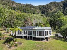 445 Petsch Creek Road Tallebudgera Valley QLD 4228 Embrace life's simple pleasures and escape to a tranquil hinterland retreat that offers serenity and seclusion. Wrapped in nature and occupying a 7.43 acre allotment, this delightful home radiates warmth and charm. Timber floors throughout enhance this cheerful ambience, complemented by fresh, light-filled interiors that are instantly welcoming. It's also designed to gaze out upon the picturesque valley views that surround it, with this spectacular outlook framed by triple bay picture windows in the formal lounge. Additionally, take advantage of the luxury of space, with a sunny living and dining area nestled next to the kitchen and a large rumpus/multi-purpose room ready to be used as your heart desires. Four generously sized bedrooms also feature, including a master suite that spoils you with a walk-in robe and stylish ensuite, while a modern main bathroom caters to the rest of the bedrooms. Outdoors, restore your senses amongst nature or relish endless fun and adventure with the kids as you explore this acreage landscape. There's also a handy 2-bay shed with drive through access plus solar panels for energy efficiency. Tucked away at the end of a peaceful and private cul-de-sac, it's just 7 minute's drive to local Ingleside State School and approx. 16 minutes to St Andrews Lutheran College. Swap the bushland for beaches in 20 minutes at Burleigh Heads, and if travel beckons, Gold Coast Airport is approx. half an hour from home. This is your chance to farewell urban chaos in favour of a life nestled in nature – arrange your inspection today. House Features: Fresh, light-filled interiors gazing upon picturesque valley views Timber floors throughout enhance its warm and welcoming charm Tastefully appointed kitchen with wooden bench tops, walk-in pantry, 4 burner electric cooktop and oven Sunny living and dining area with air-conditioning and access outdoors Oversized lounge room enriched with triple bay picture windows, framing lush hinterland vistas Large rumpus room with dual external access and laundry nook Master suite with fan, built-in robe, outdoor access and stylish ensuite with shower, vanity, and toilet Three additional bedrooms with fans and built-in robes Modern main bathroom shower, vanity, bath and separate toilet Property Features: 7.43 acre estate nestled at the end of a cul-de-sac 6m x 6m 2-bay shed with drive through access Solar panels Water tank and septic tank.