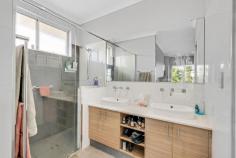50 Valentine Road Binningup WA 6233 Express sale all offers presented by 3rd December unless sold prior. You'll fall in love with this beautiful home located in the beach side community of Binningup. Located on the high side of the street, the feature stone grand portico and glazed front door certainly make a big impression. Entering the home you're greeted by a spacious hallway which has high ceilings and to the left the large master suite offers views of the front garden, ceiling fan, a generous walk in robe, plus ensuite with big shower, double vanity and separate WC. The impressive home theatre has a recessed ceiling, a great room for kicking back and watching your favourite shows. Opposite, the good sized study/potential 5th bedroom has a sliding door to the outside garden. The family, meals and kitchen area is flooded with natural light and is the central hub of the home with a reverse cycle air conditioning ceiling cassette. The kitchen offers an island bench breakfast bar with caesar stone bench tops and over bench feature lighting, built in double sinks, a massive walk in pantry, dishwasher, gas cooktop, 900mm under bench oven and plenty of cupboards. The three generous sized minor bedrooms all offer a single built in robe plus ceiling fan, with easy access to the second bathroom featuring separate shower, vanity and bath. The functional laundry offers plenty of bench space and cupboards plus a big linen press. The main living area offers double sliding doors to the rear of the home and also to the alfresco area that offers views of both the garden and views of the Binningup golf course which Twiggy Forrest's property development company Fiveight have purchased and has plans to re-develop. This lovely home also offers a double garage with direct access to the home, side access and additional parking. This low maintenance, modern property built in 2013, enables you to enjoy the ambience of being surrounded by nature with the golf course at your back fence and to be able to hear the soothing sounds of the waves at the beach which is a stroll away at the end of the street.