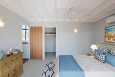 9/3 MANGO AVENUE EIMEO QLD 4740 $630,000 Be on holiday permanently & live a resort lifestyle daily at this uniquely designed, three-level, stunning home that enjoys constant seabreezes, being a mere 20-30 steps away from the patrolled waters of Eimeo Beach Surf Club! As part of a sought-after, private community, this beautifully positioned multi-level home with an inground pool offers beachside living at its absolute best. Feel like you're on vacation all year round! The top level of the home (third level) is an Entertainer's Dream with a massive timber deck running the length of the entire home, flowing from the open-plan lounge/dining area. Inside, cool & beachy polished timber floors host a large expanse of space, anchored by the corner kitchen with a breakfast bench. A large split system air conditioner services the entire open plan area along with the natural cool sea breezes with excellent cross-flow ventilation through the entire house, showcasing white curtains that frame sliding glass doors to the deck & stunning high raked ceilings with exposed beams for an additional touch of class & sophistication! The second level hosts the master suite & two built-in bedrooms. The Master enjoys it's own access to a private deck that overlooks the inground pool & subtly offers both a walk-in wardrobe & efficiently designed ensuite, ceiling fan & split-system air conditioner. Bedrooms two and three are carpeted, air-conditioned, and contain ceiling fans, and built-in double sliding door wardrobes & both are located adjacent to the bathroom & laundry. As a beautiful architectural element & the central showpiece of the home, the stunning staircase is balanced with a light and airy void on the opposite side, giving the illusion of even more volume to the design & convection of cool breezes always. Downstairs offers car accommodation for two vehicles plus an additional lock-up storage room that has the potential to transform into another room; an entertainment area, or just continue to be utilized as a very practical storage space. As part of the beautiful Eimeo community, you have endless wonderful venues and experiences at your doorstep. Steps away, you will find the iconic Eimeo Hotel with its epic ocean views, while your weekends will be filled with lounging under shady trees at the patrolled Eimeo Surf Club Beach. Perhaps long, relaxing walks in the sea breezes are your thing, or for the more active types, plenty of options for boating, fishing, crabbing or swimming are all in abundance! Maybe you'd just prefer to swan around in your own pool in the privacy of your own resort-style landscaped surrounds - it's a tough decision with so many options! Be really quick to secure this stunningly unique property in one of Mackay's most reputable locations with a lifestyle to match!