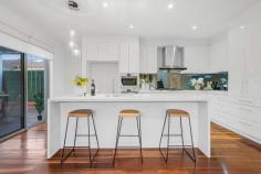 Unit 1/5 Howe St Murrumbeena VIC 3163 $1,400,000 Get ready and get set to fall in love freestanding front residence, offering the supreme flexibility of four bedrooms and dual living with ducted vacumm system, and all the space you need and more within a family-friendly location so close to Murrumbeena Park and junior sports clubs. Its all in store for you and more here, starting with high quality finishes including impressive frontage to Howe Street, rich timber floors, wide hallways and of course, streaming north-western sun that bathes the entire rear living space in natural light. Beyond the hallway, youll love coming home to a gourmet kitchen with stone benches, gloss cabinetry and stainless steel Bosch appliances, where you can entertain in the adjoining dining area, relax in the spacious rear lounge, head outdoors to your private deck and lawns, or even send the kids upstairs to their very own retreat. With the main bedroom downstairs, peace and quiet will be yours, complete with a walk-in robe and fully-tiled ensuite with walk-in shower, while the rest of the bedrooms are upstairs; all a great size with built-in robes and another immaculate bathroom. With a powder room, numerous linen closets, alarm, central heating/cooling, spacious laundry and an extra large garage (with extra OSP in front), this home is a quick stroll to the park, five minutes to Hughesdale station and cafes as well as close to the Murrumbeena shops to create the perfect combination of high quality and low-maintenance.