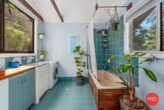 128G Friday Creek Road Upper Orara NSW 2450 $699,000 to $759,000 "Discover your personal slice of paradise! Nestled on a sprawling 2-hectare rainforest retreat, this property is a permaculture sanctuary with a babbling spring-fed creek meandering through the land, setting the stage for a tranquil and one-of-a-kind ambiance. What sets this property apart? It's not just one home; you'll have two! The main house, a charming 2-bedroom haven, boasts exquisite reclaimed timber floors, cathedral ceilings adorned with timber beams, a cozy fireplace, and a generous deck for embracing the beauty of nature. The second dwelling, a rustic-style studio, is fully self-contained, ideal for guests or generating income through Airbnb or long-term rentals. There's a wealth of resources to enjoy, from unlimited spring water, gravity-fed to your doorstep, to solar hot water in the summer and a warming fireplace with gas backup for winter, ensuring minimal utility costs. Immerse yourself in the harmonious melodies of birds and rustling trees, undisturbed by car noises. This property is a haven for rare bird and animal species, including the critically endangered Wompoo Pigeon, making it a paradise for birdwatching. Situated just 17 kilometres from Coffs, it offers convenient access to town while feeling worlds away. With bushwalks at your doorstep and hidden waterfalls scattered throughout the valley, this is a dream come true for nature lovers. Don't let this rainforest retreat slip through your fingers. Contact us today to schedule a viewing and experience the enchantment of this unique property." • Ceiling Fans • Fire Place • Solar hot water • Spring fed water tanks • Orchid • permanent spring creek