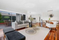 Unit 1/5 Howe St Murrumbeena VIC 3163 $1,400,000 Get ready and get set to fall in love freestanding front residence, offering the supreme flexibility of four bedrooms and dual living with ducted vacumm system, and all the space you need and more within a family-friendly location so close to Murrumbeena Park and junior sports clubs. Its all in store for you and more here, starting with high quality finishes including impressive frontage to Howe Street, rich timber floors, wide hallways and of course, streaming north-western sun that bathes the entire rear living space in natural light. Beyond the hallway, youll love coming home to a gourmet kitchen with stone benches, gloss cabinetry and stainless steel Bosch appliances, where you can entertain in the adjoining dining area, relax in the spacious rear lounge, head outdoors to your private deck and lawns, or even send the kids upstairs to their very own retreat. With the main bedroom downstairs, peace and quiet will be yours, complete with a walk-in robe and fully-tiled ensuite with walk-in shower, while the rest of the bedrooms are upstairs; all a great size with built-in robes and another immaculate bathroom. With a powder room, numerous linen closets, alarm, central heating/cooling, spacious laundry and an extra large garage (with extra OSP in front), this home is a quick stroll to the park, five minutes to Hughesdale station and cafes as well as close to the Murrumbeena shops to create the perfect combination of high quality and low-maintenance.