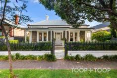 50 Hewitt Ave Rose Park SA 5067 Hewitt Avenue is unquestionably one of Adelaide’s most exclusive residential addresses, and this magnificent bluestone villa of outstanding character is one of the finest to grace it. A recent restoration has deftly combined elegant Victorian architectural features with stylish contemporary interiors to produce an impressive family home of exceptional quality. Through the original wrought iron gate, the distinguished façade of refined symmetry boasts a deep portico veranda and double sash windows to either side of a front door with leadlight detail. With soaring decorative ceilings, two embellished archways and Baltic floorboards, the long hallway is infused with light and forms a central axis from which spacious and highly versatile living, accommodation and dedicated workspace options extend. Overlooking the front garden, a gracious lounge with a marble fireplace makes a superb reception room for formal occasions or second living retreat. Four generously proportioned bedrooms include a sophisticated primary haven that boasts a marble fireplace, walk-in robe, and huge hotel style ensuite with a luxuriant bath and designer fittings. A frosted glass wall and door cleverly isolates the WC, which doubles as a powder room with hallway entry for guests. The family bathroom is also large and beautifully appointed. A private study with a built-in workstation and shelving is the ideal place to work from home, whilst the ultimate “man cave” is a wow-factor indoor workshop for those who love to tinker. With a workbench and storage, this versatile room adjoins the laundry and could be easily adapted to suit one’s requirements. Down a flight of stairs is a cellar perfect for the wine collection or extra storage. Open plan living is of outstanding specification and is the ideal expanse for everyday family enjoyment and flexible entertaining. Full length windows and sliders effortlessly connect to outdoor entertaining and capture views over the delightful rear garden and pool. Underpinned by warm oak floors, the all-white kitchen incorporates a range of fully integrated appliances, a mirrored splash back that reflects the garden, and a massive island bench adjacent to casual meals and living with floating TV cabinetry. Sliders spill through to a wraparound dining/entertaining deck with a pizza oven, that overlooks the enchanting rear lawn and tranquil white tiled solar heated pool. An outdoor WC means no wet feet need come inside. Spectacular star jasmine provides a fragrant backdrop and conceals the double garage with valuable rear lane access. This is an outstanding opportunity to secure a glorious fully renovated family home on one of Adelaide’s most coveted avenues. FEATURES IN DETAIL - 2017 renovation with interiors by Fenwick Design - Commemorated by a feature engraved floor slate - C-bus system - Heated saltwater pool - 2 x Electrolux ovens - Fully integrated F& P Fridge & Freezer - Fully integrated Miele dishwasher - Rear lane access from Claridge Lane - Remote entry double garage - Solar panels with 10 kW inverter - Ducted air conditioning - Cellar - Marble fireplaces & high ornate ceilings - Automated ensuite window & blind - Linen cupboards - Built-in speakers - 3 phase power - NBN - Alarm - Automatic irrigation LOCATION - Sought after eastern city fringe - Less than 3km to Victoria Square - Walk to Victoria Park, Dulwich shops & local cafes - Walking distance to the East End & CBD SCHOOLS - Zoned for Rose Park Primary & Marryatville High School - Central to numerous colleges including Loreto, Seymour, Pembroke, Prince Alfred College, St Ignatius Junior School SHOPPING - Minutes from popular shopping including Burnside Village, Norwood Parade, Kensington Road & Dulwich Village Auction