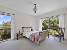 22 Landy Rd Foster VIC 3960 $720,000 Only a few minutes walk from the centre of town, this unique property enjoys the best of both worlds. Set on approximately 1051m2 of gardens with views out over the treed surrounds to the distant ranges with a wonderful connection to nature, with the convenience of all of the town amenities close by. Superbly maintained both inside and out with large rooms, high ceilings and large areas of glazing framing the delightful outlook. Open plan living room features polished timber flooring, wood heater and RC/AC. A spacious sunroom adjoins with a soaring ceiling, feature skylight and bi-fold glass doors leading out to a large covered entertaining deck, making this a flexible space that can be used to naturally heat and cool the home. The kitchen is a delight with country style cabinetry, feature recycled Oregon timber benchtops and the star of the show, a 'Falcon' 900mm dual fuel range with gas hob and double oven. There are three large fitted bedrooms, the master complete with a light filled ensuite. A centrally located main bathroom services the balance of the home and there is also a laundry / utility room with further storage. Outside the delights continue with established native plantings, winding paths to secluded spots to sit and reflect, raised vegetable beds, fruit trees, hot house, wood shed and lockup garage / workshop with direct access. Set on a quiet no through road with the bush reserve adjoining, this is a must see for anyone seeking peace and quiet.