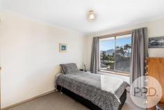 11 Kilander Crescent Berriedale TAS 7011 $649,000 + 3 Bedrooms - 2 with built-ins, main with stylish ensuite + Spacious lounge & dining area + Large modern kitchen & storage + Waters views + New outdoor entertaining area and landscaped gardens + Plenty of storage under + Double garage and workshop