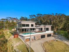 14 Lady Wakehurst Drive Otford NSW 2508 This stunning home defines luxury, from the private gated entry and huge block size to the panoramic ocean vistas from almost every room in the house. If you are looking for something truly special, then you can't go past 14 Lady Wakehurst Drive, Otford. THE HOME * One of only a handful of true prestige properties along the Northern Illawarra coastline. * The elevated position provides you with ample privacy as well as breathtaking 200o views extending along the coastline and out over the ocean. Photos cannot do justice to the breathtaking outlook from this stunning property, every day offers something new and just as amazing as the day before. Watch the sun rising over the horizon, whales frolicking and and pods of dolphins playing. * A 25 metre infinity pool and spa have been built into the deck and offer a real 'WOW' factor. This engineering feat is not just visually impressive, it is the perfect space to enjoy time with family and friends during those warm summer days. * This master suite is unparalleled. Encompassing the entire top floor of the home, it features an immense main bedroom, a walk-in robe that is equally as big as the main bedroom, a beautiful ensuite and of course panoramic ocean views. Wake up to views of the sun rising over the ocean from the comfort of your bed. * The generous 9,719m2 is perched high on the hilltop, surrounded by trees and overlooks the ocean and valley below. It features ample yard space along with a storage shed and stable. * While upstairs presents an open plan living/dining layout with several spacious bedrooms, downstairs offers ultimate versatility for a parent's retreat or separate guest accommodation based on your needs. * Gourmet kitchen is a chef's dream. Spacious design, large walk-in pantry, island bench with breakfast bar and as always… views. * For those with plenty of cars and other toys, the 250m+ garage with concrete flooring is the perfect space to showcase these. It is as much of a gallery as it is a garage. WHAT ABOUT THE LOCATION? * Only a short drive to the beach, rockpool, public transport and the famous Seacliff Bridge. Embrace that relaxed coastal lifestyle with swimming, fishing, surfing, hiking and sunrise/sunset walks on the beach all available only moments from your doorstep. * Walking distance to the entry for the Royal National Park along with all of its pristine beaches and hiking trails. Enjoy a piece of untouched paradise right at your doorstep. * This is one of the most desirable suburbs on this pristine coastline. It is the perfect coastal retreat approximately 1 hour South of Sydney CBD and approximately 30 minutes North of Wollongong CBD. * Otford offers a community-based coastal lifestyle with an easy access to Sydney and Wollongong and all that the Northern Illawarra has to offer.