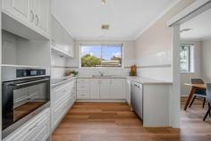 3 Roseby Street Page ACT 2614 The moment you step foot into 3 Roseby Street, Page you will feel at home. Upon entry to this charming haven you are greeted by the large separate lounge room which is bathed in natural light The dining/meals area has direct access to the upgraded kitchen which overlooks the backyard and boasts a dishwasher and loads of bench and storage space. All 3 bedrooms are generous in size, with 2 bedrooms having built in robes. All year comfort is ensured with ducted reverse cycle heating and cooling throughout the property. Step into a timeless bathroom adorned with cedar paneling on walls and ceiling. Convenience is key, with a single lock-up garage and carport on this low-maintenance block. Features include: 3 generous bedrooms Built in robes to 2 bedrooms Reverse cycle heating and cooling Floating hybrid timber floors through the dining/meals area/kitchen and hallway Single garage and carport Low maintenance gardens Foxtel ready Nestled next to the Belconnen town center and in proximity to schools and education facilities, this property seamlessly combines style, comfort, and location. Don't miss the opportunity to call 3 Roseby Street home - where modern living meets classic charm.