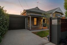 7 Filsell Street Thebarton SA 5031 $1,150,000 Set on an easy to manage approx. 465m2 allotment, this stylishly updated four-bedroom villa offers a new lease on life with all the convenience of life on the city fringe. Located on quiet Filsell Street in the heart of Thebarton, enjoy four bedrooms and a study under the main roof, a sparkling new ensuite and main bathroom, and a fabulous architectural extension by EcoUrbane. Behind secure fencing, a classic villa façade and verandah guide you onto timber floors beneath pendant lighting. Retaining the warmth of timber doors and door frames, each bedroom is its own spacious sanctuary, with an inspired ensuite added onto the first bedroom. The fully-tiled main bathroom includes a freestanding bath and large vanity, while a generous new laundry includes plenty of storage and external access. Yet it's the open plan living and Alfresco where you'll spend most of your time. Cavernous and comfortable yet undeniably contemporary, enjoy custom timber cabinetry to the lounge that ties into that of the kitchen. The kitchen centres under pendant lighting around the stone-topped island bar, with plenty of storage and surface space at your disposal, and quality appliances including an integrated dishwasher, stainless steel oven and induction cooktop. Push back the bifold windows over the sink to enjoy fabulous flow to the outdoors, and a great place to sit and keep the chef company. More glass can be pushed back to connect the indoors to the striking deck, a dream for sunny days and balmy nights. Constructed to retain established trees, enjoy multi-level garden beds, a built-in BBQ and bench seating. Finally, towards the rear of the property, 'man cave' or rumpus is the perfect blank canvas for your hobbies or casual entertaining. Coming together to shape a true entertainer's paradise, this wonderful home is ready to please its next chapter of residents in Thebarton. Enjoy a handy location that's both city and coast-centric, with easy access to Adelaide Airport, North Adelaide, the western parklands and so much more. More features to love: - Secure carport with panel lift door and further secure off-street parking behind electric gate - Double glazed windows throughout - BIR in 3 bedrooms - Ducted evaporative A/C throughout - Low maintenance landscaped outdoor entertainer's deck - Detached rear retreat/theatre room - Fabulously productive established trees including citrus, olives, stone fruit, and figs - Hydronic Underfloor Heating throughout - Solar panels on the roof, featuring a 6.6 kW system with a European inverter - Walking distance to Foodland, Mister Sunshine, local bakeries and more - Zoned to Adelaide High and Adelaide Botanic High, easy access to Torrensville Primary and within the catchment area for Torrensville Preschool Centre - Close to tram and train stops to the CBD and beyond - Just 1.5km to the Adelaide CBD and 7km to Henley Beach