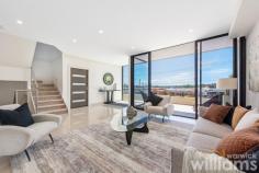 5A Fortescue St Chiswick NSW 2046 Revealing a captivating views out to Abbotsford Bay, Parramatta River and beyond, this north-facing residence balances architectural luxury with low-maintenance living. The home offers the complete lifestyle package, in a prestigious idyllic waterside address. Framed in walls of glass to welcome an ever-changing view, it's elegant interiors lengthen out to a poolside terrace with a kitchen, ideal for private entertaining. The four bedroom family home offers state-of-the-art design with impeccable style, quality and sophistication in a highly sought-after location. 650m to Chiswick Wharf, 500m to Chiswick Village and 450m to Campbell Park. • Combined living/dining space in addition to a sunken lounge • Dual outdoor flow promotes seamless cross-flow ventilation • Mosaic-tiled heated swimming pool and poolside bathroom • Stone kitchen with waterfall edges, stainless steel Miele gas cooking • Travertine tiled outdoor living and entertainers terrace • Four bedrooms with built-ins, master with his/her walk-in robes and balcony • Master includes a private balcony and ensuite, tiles bathrooms • Ducted air-conditioning, downlights, three-step cornices and timber floors • Double lock-up garage has ample storage and internal access