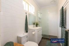 42 Turon St Morley WA 6062 $539,000 Like a beautiful beacon calling you home, this sensitively renovated 1960s home glows with its fresh, neutral colour scheme, polished jarrah floors with a mirror-like finish and sensitive updates/modernisations. A private front courtyard offers an impeccable outdoor entertaining space, the central open plan is a relaxed space to gather with friends and family and the modern kitchen is a practical and on-trend area to prepare easy mid-week meals and memorable celebratory feasts. 3 bedrooms 1 bathrooms Renovated 1960s charmer OP living and entertaining Fabulous modern kitchen Chic bathroom and laundry Landscaped front courtyard Firepit & integrated seating Double carport solar panels 312 sqm no-fee strata lot The glitter of a polished gem It is not an exaggeration to say this home sparkles with the effects of a top-to-toe renovation. Jarrah floors extend across the plan, providing a cohesive element and underpinning a commitment to retaining original integrity while introducing new, modern materials. A central open-plan living space is bathed in natural light thanks to a picture window on the enclosed front garden, lawn and an outdoor entertaining zone. At one corner of the central living zone is a chic, modern kitchen with a small timber-topped island, crisp white overhead and under bench cabinetry, an electric oven, gas hob and dishwasher. Warm grey tiles with sharp white grout fashion a striking splashback and tie together the stainless-steel appliances and cabinetry. In the family room, an electric fire with a stone surround offers a focal point and the promise of wonderfully cosy nights during the cooler months. French doors connect the dining area to the outdoor living space, where a firepit, built-in seating and decking are sheltered within high courtyard walls. A door from the living zone leads to the bedroom wing, an arrangement of three generously proportioned rooms, all with built-in robes. The main bedroom boasts a white beadboard wall, a wall of fitted robes and a large picture window. Both junior rooms are finished to an exceptionally high standard. The family bathroom and laundry are an exercise in style and function with a limited palette of colours and materials producing modern, minimalist and inviting spaces. The strong sense of stylish functionality continues in the laundry with its built-in storage and worktop. Don’t miss the opportunity to inspect this beautifully presented, stylishly renovated Morley home. Neighbourhood parks and reserves, Galleria Shopping Centre, and a choice of local schools give this property an abundance of appeal for young families, downsizers, and first-time home buyers.