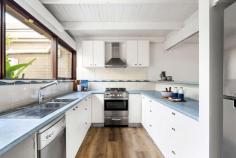 5/163 Mount Eliza Way Mount Eliza VIC 3930 $575,000 - $627,000 Inspiring a retreat-like lifestyle with its effortless charm and light-filled interiors, this rear unit of only five maximises space and convenience with a premium address only footsteps from Mount Eliza Village and Mount Eliza Secondary College. Presenting the perfect mix of comfort and scope, the two-bedroom one bathroom layout opens with a central living and dining area amongst a practical kitchen design complete with freestanding cooker and dishwasher. A wall of glazing helps merge the inside with the out, bringing pops of garden colour to an interior colour palette of neutrals. Generous in size and light, the two bedrooms each with built-in robes share direct access to a main bathroom, where a walk-in shower and space for the washing machine further functionality. A large covered deck, solar system, split-system heating and cooling, established gardens, rear shed and a double carport increase appeal, whilst a high-sought position within Mount Eliza Way promises a lifestyle of convenience with a short stroll to major retail, boutiques and thriving cafes.