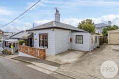 5 Stanley Street Sandy Bay TAS 7005 $780,000 As you step inside, you'll be greeted by a warm and inviting atmosphere from this lovable circa 1890's cottage. Both bedrooms are doubles and have built in robes and the high ceilings, leadlight, high skirting boards, picture rails and fancy architraves all transport you to a bygone era. The open fireplace adds a cozy touch to the living space, perfect for those chilly winter nights. The big surprise inside is the size of the back bedroom. It would be easy to split this room into 2, thus creating a third bedroom and immediately adding value to the property. Outside, you'll find a lovingly maintained courtyard, ideal for enjoying a morning coffee or hosting gatherings with friends and family. If convenience is important, then from your doorstep, a 4-5 minute walk to Magnet Court and Sandy Bay shopping precinct will offer you: shops, cafes, first class restaurants, 2 major supermarkets, specialty stores, medical facilities and of course other forms of retail therapy. Nearby public transport makes commuting a breeze and there are schools, UTAS, Wrest Point Casino, sporting facilities and beaches all in the suburb of Sandy Bay. The CBD with all it has to offer and Salamanca Place are both within a comfortable stroll from your front door. For added peace of mind, there is a security system and if saving money on electricity is important, solar panels have been installed.