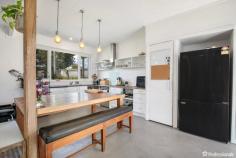 11 Church Avenue Uralla NSW 2358 $440,000 - $480,000 Nestled in the heart of the serene town of Uralla, 11 Church Avenue unveils a distinctive two-storey residence, graciously occupying a generous 910-square-meter parcel. Situated on a peaceful street, this home enjoys proximity to educational facilities with Uralla Central School just a block away, while the vibrant main street beckons a mere two blocks distant. Upon entering the residence, the lower level unfolds with a modern kitchen that seamlessly combines functionality and style, boasting ample space for a double fridge and equipped with a convenient dishwasher. The warmth of a wood heating system enhances the ambiance, creating a cozy atmosphere throughout. This level further accommodates a versatile living room, which can easily transform into a guest bedroom as needed, a home office space and an integrated laundry/bathroom completes the practicality of the ground floor. Ascending to the second level, discover a well-designed layout hosting four bedrooms, three of which feature built-in robes, offering both comfort and storage solutions. The central bathroom ensures convenience for the upper level residents. A second expansive living area on this floor provides a private retreat for relaxation and leisure. This residence embraces year-round comfort with reverse cycle air conditioning units strategically placed on both levels. Stepping outside, an inviting 16m x 3m lap pool awaits, presenting an ideal oasis for recreation and fitness. The outdoor entertaining area beckons for gatherings, complemented by the presence of two garden sheds catering to storage needs. 11 Church Avenue stands as a testament to modern living, blending practicality with sophistication in an enviable location. With its thoughtful design, abundance of living space, and enticing outdoor features, this property invites you to experience the epitome of relaxed and stylish living in the heart of Uralla.