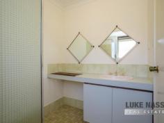 12 Cockram Rd Kelmscott WA 6111 $600,000 Welcome to 12 Cockram Road Kelmscott. Situated on a huge elevated 947m2 block, nestled away in the corner of a cul de sac this spacious family friendly 4 bedroom 2 bathroom plus study home will cater for large families or growing families looking for big bedrooms, multiple living areas and a fabulous floor plan. The backyard is a massive blank canvas at present, but let your imagination run wild as there is plenty of room for a pool, workshop and sprawling patio, with a backdrop of trees, shrubs and mother nature on your doorstep, what a fabulous place to live. The property is located in a very secluded enclave of Clifton Hills, where peace and tranquility surrounds you, but still very close to all amenities, public transport and fabulous schools for the children. Selling features include: Solid brick and tile home – Double carport with gated access to the rear – Separate formal entry – Huge lounge/TV room with meals area – Large kitchen with big fridge recess, plenty of bench space and breakfast bar – Open plan family / games area – Large master suite, easily fits a king size bed, with ensuite and walk in robe – Front study or nursery – 3 huge guest bedrooms all with built in robes – Good size family bathroom with shower and bath – Separate WC – Shade cloth pergola entertaining area – 2 garden sheds Plus more. Other selling features include: Ducted evaporative air-conditioning – Roller shutters throughout the house – Tiled flooring in thoroughfares – Brand new carpet to the lounge and master suite – Electric cooking and gas hot water system.