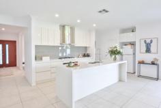 1 Bligh Court Mildura VIC 3500 $649,000 - $713,000 Katrina Wootton, Sales Agent and Marketing Specialist, at Ray White Mildura welcomes to the market a stunning four-bedroom family home situated in the heart of Victoria's vibrant Sunraysia region. This exquisite brick veneer residence, nestled on a generous plot of 750 square metres, is designed to cater to the needs of modern families seeking both comfort and convenience. Upon arrival, double doors beckon you into a welcoming entryway, leading to a separate lounge where tranquillity meets sophistication. The heart of the home unfolds into an open-plan dining and family room, bathed in natural light, ideal for family gatherings and creating cherished memories. Culinary enthusiasts will be delighted by the kitchen, featuring the most elegant stone benchtops, a large butler's pantry for additional storage and meal preparation space plus a suite of contemporary amenities that make hosting an effortless affair. The master bedroom is a true sanctuary, boasting a walk-in robe and a luxurious ensuite that continues the elegance with the stunning stone bench tops, a double vanity and separate toilet. Additionally, three well-appointed bedrooms, all with built-in robes, ensure ample space for the entire family. The main bathroom, complete with a full-size bath and large shower, is designed for relaxation and ease of use plus the luxurious powder room ensures efficiency with the home. Climate control is a breeze with reverse cycle heating and cooling, supplemented by solar panels and a natural gas-boosted hot water service, ensuring comfort and efficacy year-round. The double car garage offers secure parking and storage solutions. Entertaining is a delight in the outdoor area, featuring downlights and both gas and water points, perfect for alfresco dining and social events. Side access opens to a meticulously maintained garden, featuring automatic sprinklers for easy upkeep. The practicality continues with a well-designed laundry, equipped with ample storage to keep your home clutter-free. This property is an exemplary choice for families looking for a home that blends style, space, and functionality.