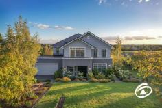 25 Kostic Blvd Narre Warren North VIC 3804 $2,350,000 - $2,450,000 Perfectly positioned on half-acre of beautifully landscaped gardens, this simply stunning Hamptons-inspired residence offers luxurious family living in an incredible location. Meticulously crafted by Porter Davis, spanning over 38 squares of living, this home blends sophistication with absolute comfort, promising an unparalleled lifestyle. Boasting 4 generously proportioned bedrooms, each accompanied by its own ensuite, including a lavish master suite featuring a private balcony, taking in stunning views of the surrounding landscape. A dedicated study situated at the front of the home provides a serene workspace or quiet retreat for remote professionals. Entertain in grand style with multiple living areas, including a formal lounge adorned with a gas log fire for cozy evenings. A relaxed family living zone, sunlit dining room, rumpus, and expansive upstairs retreat ensure ample space for every member of the family. Forming the centrepiece of the home, the beautifully appointed kitchen, is a culinary haven equipped with quality appliances, a separate walk-in pantry, and a butler's kitchen, ensuring functionality and elegance. Step outside to the decked alfresco area overlooking serene garden views, complete with a spectacular swimming pool, the perfect place to spend warm summer evenings with the family. Situated in a highly coveted pocket of Narre Warren North and surrounded by quality homes. Enjoy the peace and privacy of ‘semi-rural’ living while remaining close to all amenities, quality education, and convenient commuting options. Ready for endless enjoyment, this is your chance to secure the ultimate in upscale living!