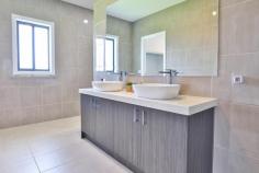 1 Bligh Court Mildura VIC 3500 $649,000 - $713,000 Katrina Wootton, Sales Agent and Marketing Specialist, at Ray White Mildura welcomes to the market a stunning four-bedroom family home situated in the heart of Victoria's vibrant Sunraysia region. This exquisite brick veneer residence, nestled on a generous plot of 750 square metres, is designed to cater to the needs of modern families seeking both comfort and convenience. Upon arrival, double doors beckon you into a welcoming entryway, leading to a separate lounge where tranquillity meets sophistication. The heart of the home unfolds into an open-plan dining and family room, bathed in natural light, ideal for family gatherings and creating cherished memories. Culinary enthusiasts will be delighted by the kitchen, featuring the most elegant stone benchtops, a large butler's pantry for additional storage and meal preparation space plus a suite of contemporary amenities that make hosting an effortless affair. The master bedroom is a true sanctuary, boasting a walk-in robe and a luxurious ensuite that continues the elegance with the stunning stone bench tops, a double vanity and separate toilet. Additionally, three well-appointed bedrooms, all with built-in robes, ensure ample space for the entire family. The main bathroom, complete with a full-size bath and large shower, is designed for relaxation and ease of use plus the luxurious powder room ensures efficiency with the home. Climate control is a breeze with reverse cycle heating and cooling, supplemented by solar panels and a natural gas-boosted hot water service, ensuring comfort and efficacy year-round. The double car garage offers secure parking and storage solutions. Entertaining is a delight in the outdoor area, featuring downlights and both gas and water points, perfect for alfresco dining and social events. Side access opens to a meticulously maintained garden, featuring automatic sprinklers for easy upkeep. The practicality continues with a well-designed laundry, equipped with ample storage to keep your home clutter-free. This property is an exemplary choice for families looking for a home that blends style, space, and functionality.