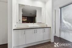 5 Johansen Rd Byford WA 6122 $749,000 Team Appleton Swart are excited to introduce this stunning property to the market for the very first time. Built in 2014, and exceptionally designed from head to toe, you will fall in love with both the layout and features of this 222sqm home from the minute you arrive. Upon opening the double front doors, you are welcomed by a generous entry hall and are immediately drawn to the beautiful Marri engineered timber flooring that is a gorgeous feature throughout the home. A wide hallway guides you through into the main living and meals area, where you will need to take a moment to absorb the spacious feel of this zone. The heart of the home is the stunning kitchen, which showcases everything you could imagine your dream kitchen would, including an expansive island bench, soft close drawers, plenty of storage and bench space, all overlooking the alfresco area. A separate theatre room is conveniently located towards the front of the home, and could easily be utilized as your home business without interrupting the rest of the household, or as a fourth bedroom. The master suite is discreetly tucked away and features a king-sized space with walk in robe and ensuite, and access to a Balinese-style garden and gazebo, where you can relax in your private oasis. Towards the rear of the home is where you will find the guest wing, featuring two exceptionally large bedrooms, main bathroom, laundry, and powder room. Set on a manageable 603sqm block, the outdoor oasis is truly breath taking, featuring paved alfresco area, lush gardens, a jacuzzi under gazebo, and ample lawn for the pets and kids. Located in the leafy Byford Glades Estate (Coral Gardens) you are surrounded by a plethora of parks, gardens and playgrounds. Just a short stroll to the nearby shopping precinct where you will be spoilt for choice of the many restaurants, IGA, and the renowned Found Lab brewery. If you are looking to downsize, but don’t want to downgrade, then this stunning home is a must see. A seamless flow and functional design, coupled with modern styling and fixtures, means this home is a must see. FEATURES BULLETS: • 3-bedroom x 2-bathroom home on 603sqm block in the Byford Glades Estate • Master Suite includes WIR, Ensuite with Vanity and Shower, and private access to your own tropical oasis • Two minor bedrooms are both super king size, with BIR. • Double garage • Paved Alfresco area with ceiling fan, ideal for entertaining • Jacuzzi under gazebo that gives you the feel of being on holiday in your own backyard • Ample sized lawn area for the kids and/or pets • Manicured, easy care lush gardens with reticulation • Separate Cinematic Theatre/Games Room/4th bedroom • Laundry with large bench and linen cupboard • Open plan Kitchen/Living/Dining overlooking the paved alfresco • Kitchen features so much storage, island bench, 900mm Stainless Steel Oven, rangehood and cook top, Dishwasher, Appliance cupboard, Soft close drawers, and large fridge recess. • Main bathroom is spacious with a bathtub, vanity and large shower recess • Two generous and convenient Powder rooms Added extras include: Ducted Reverse Cycle Air Conditioning throughout, skirting boards, solar panels, rainwater tank, Instant Gas HWS, security screen doors and much more!