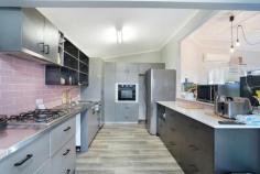 1 Hickey St Cessnock NSW 2325 $580,000 – Ideal opportunity to enter the market in a sought after residential street! – A perfect mix of old and new with ornate and high ceilings mixed in with modern touches – Three large bedrooms, all with built in robes and ceiling fans and a separate study space to the front of the home – The main bedroom is a relatively new addition to the home with a walk in robe and modern ensuite, a real parents retreat! – Modern kitchen with plenty of storage and a mix of stainless steel and stone bench tops, highlighted by a striking pink subway tile splashback – Open plan kitchen, living and dining space with flexibility of layout to suit your needs – The main bathroom has separate shower, bath and toilet and there is a large laundry room – Outside there is a covered timber deck overlooking the low maintenance yard space on an approx. 404m2 block – Double sized garage with single roller door with drive through access to the backyard completes the package – Only 1.5kms to the CBD of Cessnock, close to primary schools, doctor surgeries, pharmacy and convenience stores