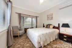 2 Bright St Ryde NSW 2112 Set on a generous 588sqm parcel of land, this much-loved family home is available for the first time in over 45 years. Set back from the road, the single-level property enjoys an elevated position in a quiet and convenient Ryde address. Offering plenty of space for growing families, the generous interiors include three bedrooms, bright living spaces, and a covered outdoor dining terrace that extends into a flowering garden with level lawn. Solidly built and well-maintained, the liveable home has plenty of potential for an exciting future makeover. Choose a stylish redesign, creative remodel, or start again with a brand-new build (STCA). Ideally located for local schools, retail and recreation. Only 200m to Ryde Park, 900m to Ryde Aquatic, 1.4km to Top Ryde Shopping Centre. • Exciting opportunity to claim a great family home in a convenient Ryde address • Queen-sized master with built-in robe, air con, and ceiling fan • Two guest bedrooms, one with built-in robe • Neat and tidy bathroom featuring shower and vanity • Two large living spaces with flow through to enclosed sunroom • Electric kitchen includes storage and plenty of benchtop space • Huge, covered outdoor dining. Large laundry and separate W.C. • Established and secure garden with level lawn, trees, and flowering plants • Off-street parking with private driveway and covered car porch