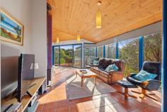 6 Acacia St Sandy Point VIC 3959 $1,100,000 Set on a low maintenance block of approx. 908m2, this unique multi level home is tucked into the treetops and just 30 metres from beach access. No roads to cross between you and the sea! Cleverly designed to connect with the coastal environment with huge areas of glass to flood the home with natural light and frame the stunning treed outlook, and multiple decks allowing the interior to spill outside. The soaring timber lined ceiling creates a wonderful feeling of space in the living room, bathed in sunlight and opening out to decks on three sides. Warm in winter with a wood heater, and cool in summer with RC/AC and the sea breeze. Well appointed kitchen is the heart of the home with a gas hob, underbench oven and servery to dining area. Two large fitted bedrooms on this level, both with adjoining decks, plus the family bathroom / laundry and separate w.c. The master suite is the crowning glory, offering complete privacy on the upper floor with expansive views and ensuite bathroom. The perfect retreat to listen to the sea. Outside, the bush block requires minimal upkeep, has parking for multiple cars with a semi-circular driveway, under home storage and water tank. Relax, recharge and connect with nature.