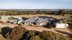 15 Island View Monjingup WA 6450 $1,700,000 Lingering lakeside views over Lake Warden are captured from this expansive 2.24ha rural residential property. Cast your eye beyond to ocean and island views of the Recherche Archipelago and night lights of Esperance townsite. Generously proportioned family home with formal and informal zones create for a perfect entertainers dream. Located on the rise of Six Mile Hill, just 8km from the town centre. Highlights of the home include; Master bedroom suite including ensuite with spa & powder room 3 double sized bedrooms – all with robes Main bathroom Formal lounge room with adjacent dining area Sitting room/games room Huge open plan living area Deluxe kitchen with Omega 900m freestanding stove, dishwasher and island workstation Bamboo timber flooring and quality window treatments throughout Conservatory/enclosed patio room 3m ceilings and 2 reverse cycle aircon units 12m x 7m triple bay shed/workshop with 2.5m opening 18m x 9m machinery shed with 3m high opening and ablutions Whole house is rainwater fed with catchment to approximately 170L of storage tanks