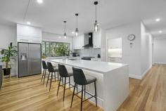 17B Karragata Court Tallebudgera QLD 4228 A statement of sleek, modern living in a prestigious and peaceful neighbourhood beckons with this superb 451m2 home. Nestled in a leafy setting of lush greenery, where towering forestry and fruit trees punctuate this 1.09acre oasis, the best of both worlds awaits here. You'll feel far removed from the urban rush of everyday life yet be only 15 minutes from picturesque Palm Beach. Designed with easy family living and entertaining in mind, an expansive kitchen with marble-effect Caesarstone waterfall benchtops and a 4 seater island bench sits at the heart of the home. Fitted with a butler's pantry, it makes catering an effortless affair. An outdoor courtyard with fire pit area and pizza oven tempts you when it's time for alfresco fun or host your guests on the expansive, tree-fringed deck and savour the serenity. Afterwards, grab a night-cap from the lounge room with wet bar accented by bronzed glass. There's also a light and airy dining room with feature downlights, an oversized formal living room, plus parents can escape to the upper-level retreat, fitted with plush carpet. Four light and bright bedrooms and four contemporary, customised bathrooms add another layer of impressive elegance to this home. The sprawling master suite sanctuary spoils you with an ensuite with twin shower heads, deep soak bathtub and separate toilet, with bedrooms 2 and 3 also with ensuites. Bedroom 4 and the fourth bathroom are located downstairs and gives your guests extra privacy. Along with an office, this home boasts two double garages (one with dual living potential), solar power, security system with CCTV footage and alarm, ducted air-conditioning, 22,000 litre water tank and a town water connection as well as an additional building envelope of 220m2. Situated 4km from Tallebudgera State School and 7km from St Andrews Lutheran College, it's also a quick drive to local shops, sporting fields and amenities. Or make the 10km trip to popular Palm Beach and savour the local cafes, restaurants and boutique shopping on hand in this coastal paradise. Arrange your inspection today. Main House Features Expansive, modern kitchen with marble-effect Caesarstone waterfall benchtops and a 4 seater island bench and six-burner oven/cooktop Butler's pantry with ample storage, separate sink and dishwasher Light and airy dining room with feature downlights Oversized formal living room overlooking entertaining deck (with speakers) Lounge room/multimedia room with built-in speakers, powder room and large wet bar accented by bronzed glass Spacious upper-level living/parents retreat Sprawling master suite with makeup area and a large dressing room Master ensuite with twin shower heads, deep soak bathtub, customised dual sink vanity and separate toilet Bedrooms 2 and 3 with ensuites – 1 with a built-in robe and 1 with a walk-in robe Bedroom 4 (downstairs) with built-in robe Office with custom cabinetry Large laundry with chute from the master bedroom Modern bathroom with shower, deep soak bathtub and customised stone vanities Expansive deck with Newport HardiFlex flooring overlooking established gardens Outdoor courtyard with fire pit area and pizza oven Attached 2 car garage with electric door and built-in storage Another 2 car garage opposite the house with dual living potential (has electricity, plumbing and gas) Other Features External greenhouse plus over 70 fruit trees planted Steel frame build Tongue'n'groove Blackbutt hardwood flooring throughout Plush carpets all bedrooms and upstairs living areas 2.7m high ceilings throughout the property and 3m in garage Under stair storage LED lights, vacumaid and 9.99 kilowatt solar system Commercial zoned, reverse cycle ducted air conditioning throughout 3 Phase Power Envirocycle, 22,000L water tank for irrigation and town water connection Security system with CCTV footage and alarm Additional building envelope of 220m2 Location 4km from Tallebudgera State School 7km from St Andrews Lutheran College Quick drive to local shops, sporting fields and amenities 10km to popular Palm Beach cafes, restaurants, beaches and boutique shopping
