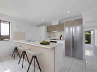 30 Kristy Crescent EIMEO QLD 4740 Welcome to this modern low-set family home in Eimeo, tucked in at the end of a quiet cul-de-sac. Families will find the offerings very appealing. The façade is eye-catching with its modern mix of textures, colours and materials. No-fuss gardens and a double remote-controlled garage, make this ideal for families who are time poor, yet have security and low maintenance as a high priority. The size of this home will impress, and it is freshly painted, ready to move straight in. Everyone can have their own space. It boasts two separate living areas; so, adults and the younger set can both have a space to lounge and enjoy their favourite activity. It may be snacking on popcorn while watching a favourite movie, enjoying family games, or just sharing good old-fashioned conversation. The kitchen will delight the home cook; with its sleek lines, gas cook-top, brand-new oven, ample storage and great bench space. When family meals are in demand, 'cooking up a storm' will be a pleasure. Evening meals in the spacious family zone will become an event and a special time to sit and enjoy a meal whilst chatting about the 'happenings of the day'. Sleeping zones are family friendly. Bedrooms are generous, with all the mod-cons you'd expect, such as built-in-robes and air conditioning. Of course, the master suite has its own private ensuite and walk-in-robe; whilst the remaining bedrooms share a modern family bathroom, complete with bathtub for infants. Entertaining will be an occasion to relish in the fully enclosed, private patio. Just set up the drink dispenser with fruit punch for the kids, along with some chips and dip so they can help themselves. The adults can mix their own drinks, sit back and relax with some 'scrummy' snacks. Wow…let the fun begin! Of course there are bound to be some great tunes playing! The kids and their mates can play outside. You'll know they are safe in the confines of the fully fenced yard. Then there is the list of the bonus features…and there are so many! Down one side, the owners have had a huge concrete pad laid (12 x 7 metres) - ready for a 4-bay shed. Adjoining is an extra concrete slab of (7 x 3.5 metres) for a game's room/workshop. There is also a designated spot ready to install a gorgeous sparkling in-ground pool. The retaining wall is brand new and has been properly engineered. Owners have all necessary plans available. Out back is another outdoor equipment shed (5 X 3 metres) There are also established vegetable gardens and fruit trees providing fresh produce. Tucked away on the opposite side of the home is a quiet little 'nook' for sitting and pondering whilst enjoying a coffee. Eimeo is such a beautiful spot, with convenient access to excellent schools, daycare centres and shopping precincts. An easy drive to patrolled Eimeo beach or Blacks Beach; beautiful white stretches of sand and glistening blue waters. Perched proudly up on a nearby hill, the historic Eimeo Hotel with its majestic views over the water will take your breath away. Enjoy a drink and a delicious meal. As a location Eimeo is hard to beat, as it is so close to bus transport, and only 20 minutes into Mackay CBD. Enjoy the casual, relaxed that lifestyle the Northern Beach has to offer.