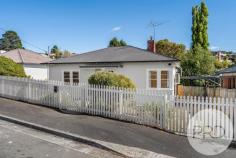 22 Hilton Road Claremont TAS 7011 $575,000 Recently renovated and ready to go for the downsizer, first home buyer or investor. 22 Hilton Road Claremont needs to be seen firsthand to appreciate what this home has to offer. Positioned perfectly with outstanding street appeal which invites you to enter the home through the attractive front garden and entry. Once inside you instantly feel the warmth and comfort of a true family home. The central hallway leads to a large living room with wood heater and reverse cycle air conditioner. There are 3 extra-large bedrooms, one with the original fireplace and another with generous built-ins. All rooms are enhanced with the convenience of newly polished Tasmanian Oak floorboards and high ceilings. Off the living you have a well-appointed open kitchen and dining area with ample of cupboard and bench space and views of the garden and back yard. The newly renovated family bathroom is complete with full-length bath, shower over, modern vanity unit and back to the wall toilet. Separate laundry and storage areas are at the rear of the home. Out back the home has an elevated verandah capturing views of the garden and back yard. The large private and secure yard is an eden of beautiful gardens and lawned areas, perfect for young ones and pets to play safely. There is a car port for 1 car and an additional 2 car parks with gate access to the back yard. Public transport is practically at your doorstep, and your only minutes away from shopping centres, schools, and all amenities. There's the intercity bike track and recreational parks close by, and you're only 20 minutes drive (Approx.) from Hobart CBD.