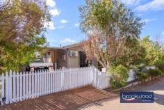 9A Gregory St Northam WA 6401 $375,000 Ideally located within walking distance of the town centre, schools, and parks, this impeccably presented home offers a flying start to first-time home buyers and gives downsizers the space to move and pursue their passions. Sited on a level lot behind a white picket fence, with scheme water and reticulation, this Hardi/Iron home boasts a stretch of decking for outdoor living and entertaining. 3 bedrooms 1 bathroom 2009-built Hardi and iron Soft neutral colour scheme Open plan living with AC Main bedroom, semi ensuite All beds with built-in robes Scheme water shed retic Carport decked alfresco 420 sqm fully fenced lot Walk town school park A white picket fence highlights the warm taupe façade of this beautifully presented home. Offering a fantastic start for young families and space for downsizers unwilling to compromise on space to garden and tinker, the flowing floorplan centres around an open plan living, meals and kitchen area finished in soft organic tones and with carpet in the lounge area. Reverse cycle air conditioning provides year-round climate control. Large windows across the plan frame garden views and bring ample light to the interiors. The kitchen is defined by a U-shaped benchtop and an integrated breakfast bar. An electric oven, four-burner gas hob, and walk-in pantry fashion a practical workspace finished in soft tones and providing ample under-bench storage. The principal bedroom boasts soft carpet underfoot, a double built-in robe, a ceiling fan, reverse-cycle air conditioning, and semi-ensuite access to the family bathroom. Carpet, built-in robes, and ceiling fans are also fitted in each junior bedroom. The family bathroom features a bathtub, shower, and vanity. Crisp white wall tiles bring a fresh finish to this well-appointed room. Decking extends beyond the front verandah to create the perfect outdoor entertaining zone. Shielded by established gardens and set under a gabled roof, this south-facing ‘outdoor room’ links to the open-plan living zone via a sliding glass door. A single carport provides covered, off-street parking and laneway access to the rear of the lot, which leads to an additional off-street parking space. Inspection will further highlight the many charms of this centrally located, neat-as-a-pin home, ready and waiting for a new family.