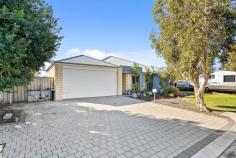 17 Vaucluse Way Coodanup WA 6210 $549,000 This low maintenance home offers a harmonious blend of comfort and style, perfect for families or investors alike. As you step inside, you'll be greeted by the open-plan living space that is generously sized, bathed in natural light, and equipped with a reverse cycle split system air conditioner for year-round comfort. The heart of the home lays within the kitchen, a central hub, complete with a breakfast bar, ample cabinetry, and stainless steel appliances. The lounge and dining areas seamlessly connect to the alfresco space, creating the perfect flow for entertaining. The master bedroom, located at the front of the home, is private and features its own reverse cycle air-conditioner, a walk-in robe, and a spacious en-suite with a vanity basin, shower, and separate toilet. Three additional bedrooms, each with built-in robes, offer comfortable living spaces. The family bathroom includes a bath, shower, vanity basin, and a separate toilet adjacent to the laundry. Outdoor entertaining is effortless with an alfresco area, and a backyard perfect for children and pets with plenty of space and lawn. Enjoy roller door access from the rear of the double garage and plenty of driveway for additional parking. This property offers an unbeatable lifestyle, just moments to the Peel Estuary, perfect for water activities such as crabbing, boating and nature walks, and is conveniently located a short drive from schools, shops, and amenities.