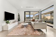 2F Egerton Ave Rostrevor SA 5073 Architecturally designed by the award winning Regent Homes, each fixture and fitting has been meticulously selected and is evident upon entering this stunning home constructed in 2023. Boasting a family sized floor-plan and sitting on an impressively sized block of 434sqm; there is plenty of room across both levels allowing privacy, space and flexibility for growing families. As you approach the front door via the stunning cantilever concrete steps and enter, you will instantly be in awe of the modern, crisp white and stone aesthetic complimented by stunning polished concrete floors. The four bedrooms are carpeted with built in wardrobes, and oversized windows eliminating the use for all day lighting. Enjoy the spacious main bedroom located on the ground floor showcasing a large walk-in robe and luxurious ensuite bathroom complete with terrazzo tiles imported from Italy, a dual-shower head, frameless shower screen and dual vanity. Transcend upstairs via the oak timber staircase into a large second living space fitted with easy clean engineered timber floors, perfect for a children’s retreat or extra guest entertaining space. The three bedrooms on this level share a gorgeous main bathroom complete with freestanding bathtub and a stunning tiling and fixture combination we are sure you'll love. The spacious downstairs living area incorporates a stunning oversized curved stone bench with plenty of room to prepare meals and entertain your guests. SMEG appliances set the bar high with style and functionality flowing through into the concealed butlers pantry which offers a built in bar, an abundance of storage along with a hidden sink and dishwasher. Avid entertainers will appreciate the undercover alfresco with built in gas line and outdoor fan. The spacious rear yard features a sparkling, electric heated swimming pool and large lawn to unwind with family and friends. Here's your opportunity to not only own an exceptionally crafted, custom-built home, but a chance to be part of a great community within this well loved location. Walk to Morialta Conservation Park on weekends, find your favourite coffee shop nearby and enjoy a selection of top-tier schooling options at your fingertips with Rostrevor College, Saint Ignatius College, Stradbroke Primary School and the brand new Morialta Secondary College just to name a few. Less than 5-minutes drive discover the well equipped Newton Shopping Centre or Firle Plaza, as well as the vibrant Parade in Norwood for shopping, café, specialty stores and weekend entertainment options. Added benefits include: *Family-sized electric heated swimming pool *Double car garaging *High fencing for privacy *Ducted and zoned, reverse cycle heating and cooling *2.7m ceiling heights *Semi commercial windows frames *Downstairs powder room with third toilet *Quality flooring throughout including polished concrete and imported terrazzo tiles *New sheer curtains *Separate downstairs laundry *Built in roof provisions for solar