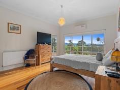4 Gabriels Lane Toora VIC 3962 $1,350,000 Stunning design, superbly maintained to present as-new, this property will delight even the most fastidious of buyers. Only a few minutes out of town via a sealed road, your private retreat- enjoying a prime sheltered northerly aspect and delightful rural views, sitting proudly at the top of the block with a wide verandah on every side. Step inside to the luxuriously appointed and expansive interior with soaring ceilings, abundant natural light, magnificent polished timber flooring and a state of the art hydronic heating system, backed up with zoned reverse cycle air conditioning. Grand entrance foyer and wide hallway. The open plan living room, with exposed trusses and large areas of glazing, captures both the abundant natural light and delightful views. Doors open to a covered outdoor entertaining deck with glimpses of the Inlet and Wilsons Promontory. Superbly appointed kitchen with huge breakfast bar, integrated appliance cupboards and branded appliances. Separate home theater room, the perfect space for family movie nights or to entertain guests. Four fitted bedrooms, the master suite adjoining an expansive ensuite. The stunning main bathroom features a frameless shower, freestanding bath tub, and separate w.c. Outside the delights continue, with an under-home garage, studio or workshop space, Aussie barn, hothouse and storage shedding- perfect for work, hobby or leisure use. Chook pen, vegetable garden, orchard, dam, and fenced paddock complemented by electric gates for easy access add the finishing touches for the ideal country lifestyle. Environmentally friendly features including a 6.6kW solar power and battery system, double glazing, triple insulation, and ample water storage, keep running costs to a minimum. A home to cherish for generations to come in this picturesque region.