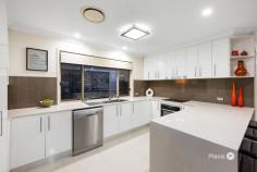 21 Lyrebird St Calamvale QLD 4116 Nestled in an established neighborhood, just a short 400m stroll from Brisbane City bus and Kameruka Street shops, this expansive single-story family home has undergone a contemporary renovation, focusing on lifestyle. Every detail has been carefully curated, resulting in a residence that surpasses new in every aspect. Step inside to discover a spacious, flowing floor plan designed for practicality and appeal to growing families. Featuring four generous bedrooms, including a master retreat with a walk-in robe and private ensuite. The two luxurious bathrooms create a hotel-like ambiance, showcasing high-quality fixtures, a freestanding bath, and stylish floor-to-ceiling tiles. Multiple living areas, including an oversized lounge room, separate family room, and spacious dining area, offer plenty of space for family activities. The heart of the home is the entertainer's kitchen, featuring stone benchtops, a breakfast bar, a ducted range hood, and 2PAC cabinetry. This culinary haven opens seamlessly to a large covered outdoor patio, ideal for alfresco dining and overlooking a resort-style pool with a separate turfed area for leisure activities. The in-ground pool, under ten years old and solar-heated for year-round enjoyment, provides a perfect backdrop for entertaining family and friends. Luxury Vinyl planking in the bedrooms and polished tiles throughout the rest of the home showcase a sophisticated yet grounded design. Plantation shutters add a touch of elegance, while Crimsafe security screens offer peace of mind without compromising aesthetics. Zoned ducted air conditioning ensures comfort throughout the seasons. Situated on a level 750m² lot with a desirable north/south aspect and wide 19m frontage, this property offers privacy from neighbors, rear yard access, and potential for add-ons like a granny flat. The home's 10kW solar system adds an eco-friendly touch to this impressive package. Ideal for savvy buyers seeking a turnkey property with no need for further renovations, this home blends classic charm and quality on a premium lot. With the owners moving on, seize the chance to secure this meticulously upgraded residence for your family's next chapter.