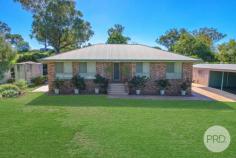 17 Herden Road Tamworth NSW 2340 $969,000 Pure exquisiteness on a sprawling 5,460sqm block in the heart of Kingswood you will find 17 Herden Road. This magnificent slice of paradise features beautiful, manicured gardens as far as the eye can see along with established trees and bushes. As you make your way up the stairs and enter this stunning home you are greeted with lovely stained-glass features incorporated into the front door, off to the left you will find an enormous sized bedroom with large glass windows that allow the natural light to seep through and fill this wonderful space. Making your way through you will come across the master bedroom that boasts a large walk in robe along with a private ensuite attached, with glass sliding doors that allow you personal access out to the back undercover patio area this room provides ultimate luxury and comfort for parents to relax. The remaining two bedrooms both offer built in robes, ceiling fans and large windows for stunning outlooks. Throughout the home you will notice plenty of storage space and charming stained-glass windows featured in the doors to the loungeroom, fitted out with reverse ducted aircon as well as gas points for heating. Make your way outside to the tiled undercover alfresco area with an installed vergola making this the perfect place to spend your evenings or for when you are entertaining friends and family, the picturesque outlook of magical gardens instils the calm and relaxing feeling this home offers. At the front of the property you will find a double lock up garage with a double carport extension attached. This shed is fully insulated with a shower, toilet and basin installed as well as an additional three bay lock up garage with an additional three bay carport extended off the front. This offers you an ample amount of car and storage space or the opportunity to create a great workshop or mancave, all of this is easy accessible with a asphalt driveway. 17 Herden Road also has 14 solar panels installed along with a solar hot water system that feeds the house.