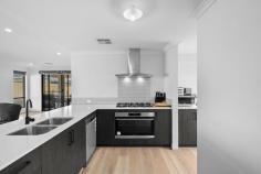 11 Lincelles St Madora Bay WA 6210 $749,000 Located in the highly sought after suburb of Madora Bay, this stunning 4 bedroom, 2 bathroom home built in 2021 by Smart Homes, offers an ideal opportunity for those seeking a sea change. The spaciousness of the home is truly highlighted by the impressive 31c ceilings in the main living areas, allowing natural light to flood the open plan family, dining, and kitchen areas, creating a bright and airy atmosphere. The centrally located kitchen features elegant stone benchtops, 900mm stainless steel appliances, a scullery and an abundance of cupboard space, ensuring a pristine and clutter free space. The master suite features a spacious walk-in robe, providing ample storage, while the ensuite is a standout feature with a double shower, double vanity, and a separate toilet, offering a private space to unwind and rejuvenate after a long day. Towards the rear of the home, an activity room connects to the three minor bedrooms. Bedroom 2 includes a walk-in robe, and bedrooms 3 and 4 are fitted with built-in robes. This area also includes the main bathroom and toilet, ensuring privacy and comfort for everyone. Additional features include a theatre room with double door entry, perfect for movie nights with friends and family as well as solar panel and Fujitsu ducted reverse cycle air conditioning for year round comfort and energy efficiency. Situated on a 450 sqm block with a 3.6 metre side access, ideal for storing the boat or caravan, and a double garage with extra height and a workshop area, providing ample space for storage and DIY activities. Don't miss your chance to own such a beautiful home located within walking distance to the upcoming St Marcellin's Catholic College that is currently under construction, the picturesque Madora Bay Foreshore, and the vibrant Lakelands Shopping Centre.