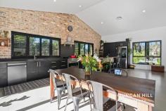 18 Badgery St Willow Vale NSW 2575 This is a home you will be thrilled to return to again and again. The design of this residence leaves nothing to chance, with unrivalled style and functionality. The large open-plan kitchen, living, and dining room boasts 4-meter pitched ceilings, an exposed recycled brick feature wall, polished concrete floors, and a slow-combustion wood fire, making it the heart of your home! Step outside onto the expansive outdoor entertaining deck. This spacious retreat beckons with panoramic views of meticulously landscaped gardens adorned with a diverse array of native plantings and the lush greenery of a meticulously tended lawn. Whether relaxing with a morning coffee or entertaining under the open sky, this inviting outdoor space seamlessly connects you to the tranquility and splendour of your surroundings. If you've been yearning for serenity, we cordially invite you to explore this remarkable property. Features include; Kemlan freestanding wood heater Double Glazed windows in living area Roller blinds Plantation shutters Ducted reverse-cycle air-conditioning 6.6kW solar panels Sleek kitchen with polished concrete bench tops ILVE 90cm freestanding electric oven and gas cooktop Matte Black LG QuadWash dishwasher with TrueSteam technology Open plan kitchen/dining that connects seamlessly via bi-fold doors to the deck and recycled brick patio Master suite with ensuite and triple robe Double robes in all bedrooms Main bathroom with floor to ceiling wall tiles, frameless shower screen and freestanding bath Irrigated lawn Established, landscaped gardens featuring vast variety of native plantings Large garage/studio
