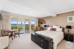 63 Scott Circuit Salamander Bay NSW 2317 Positioned in a peaceful street, this substantial brick residence epitomizes quality while boasting captivating water views that enchant from almost every angle. Meticulously designed to harness natural light, the home showcases expansive glass sliding doors that flood the interiors with sunshine, elegantly framing the serene water vistas and fostering a harmonious indoor-outdoor connection. Upon crossing the threshold, you are immediately welcomed into a grand loungeroom, exuding an atmosphere of sophistication and warmth. This inviting space seamlessly transitions to a sun-drenched balcony, creating a serene retreat for relaxation or upscale entertaining against the backdrop of mesmerizing water views. Adjacent to the loungeroom, the private dining area offers an intimate setting for gourmet meals and memorable gatherings. The heart of the home lies in its spacious kitchen, which is a culinary enthusiast's delight. Boasting ample cupboard and bench space, the kitchen is equipped to cater to both daily living and grand entertaining, ensuring every meal is a delightful experience. Descending to the lower level, a secondary living area awaits, characterized by a striking built-in bookcase that adds a touch of sophistication to the space. This versatile area serves as an ideal retreat for leisurely afternoons, family movie nights, or intimate gatherings with loved ones. The master suite is a haven of luxury and tranquility, featuring balcony access, a lavish ensuite bathroom adorned with water views, and an ambiance that invites relaxation and rejuvenation. The remaining 3 bedrooms or 2 bedrooms and study are generously proportioned, each thoughtfully designed with ducted air conditioning to ensure year-round comfort for all occupants. The home's main bathroom, while retaining its original charm, invites you to indulge in a spa-like experience, complete with elegant fixtures and finishes that enhance the sense of luxury. Outdoors, the fully retained backyard offers a private sanctuary for outdoor activities, gardening endeavors, or simply soaking up the sun in tranquil surroundings. Further complementing the home's appeal are modern conveniences such as ducted air conditioning for climate control, a double garage providing secure parking and storage, and solar panels contributing to energy efficiency and sustainable living. But wait, there is still more, on the lower level is an awesome space which would be used for a home office or a business ran from home with a sperate entrance (STCA), and there is the ideal "Man's Shed" that has been created under the house with ample area's for tool storage and workbenches. Ideally located within an approx a 900m radius of shops, sports ovals, cafes, restaurants, and the picturesque foreshore beach, this luxurious haven offers a perfect blend of convenience and coastal elegance.