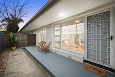 Unit 1/322 Anzac Hwy Plympton SA 5038 $500,000-$550,000 Central to city and sea with shops, schools, The Highway Hotel and the bus and tram on your doorstep, this superbly upgraded unit is an absolute must-see for investors or first home buyers. Enjoying the front position within a small corner allotment group, neat timber slatted fences and gated entry add privacy to a secluded front courtyard and porch. Inside, polished timber floors line a contemporary open and airy living, dining and kitchen space, where stunning northerly-aspect glass block windows welcome natural light, and plenty of sleek gloss cabinetry and a mint glass splashback have elevated the cooking quarters, complete with a split system air conditioner for added comfort. Two bedrooms begin with an attractive master option with modern built-in robes and a courtyard outlook, both with easy access to a central bathroom – also having undergone some upgrades – with floating vanity, shower with feature wall and convenient hidden laundry. Outside, a substantial decked alfresco under the protection of a pergola will surprise with its size; the prime possie to entertain or unwind and soak in those stunning summer sunsets. More to mention: - Built-in robes to bedroom 2 - Carport - Large rear shed - Secure private front and rear courtyards